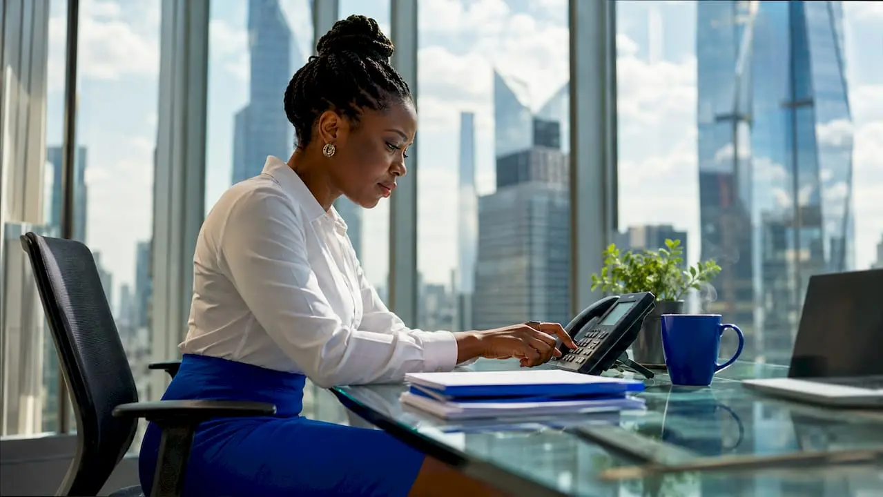 Businesswoman dialing caller friendly number