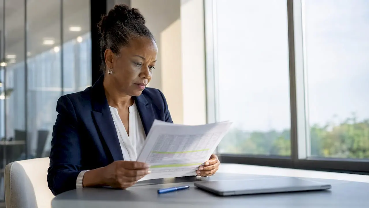 Professional reviewing business numerical ethics reports