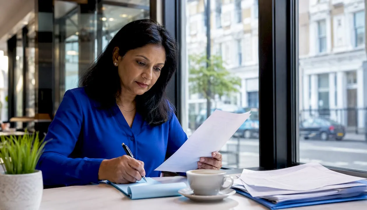 Woman reviewing UK phone number listings