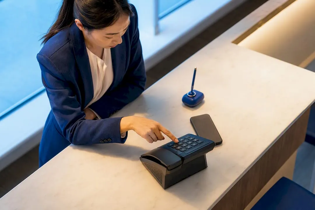 Business operator comparing mobile number formats